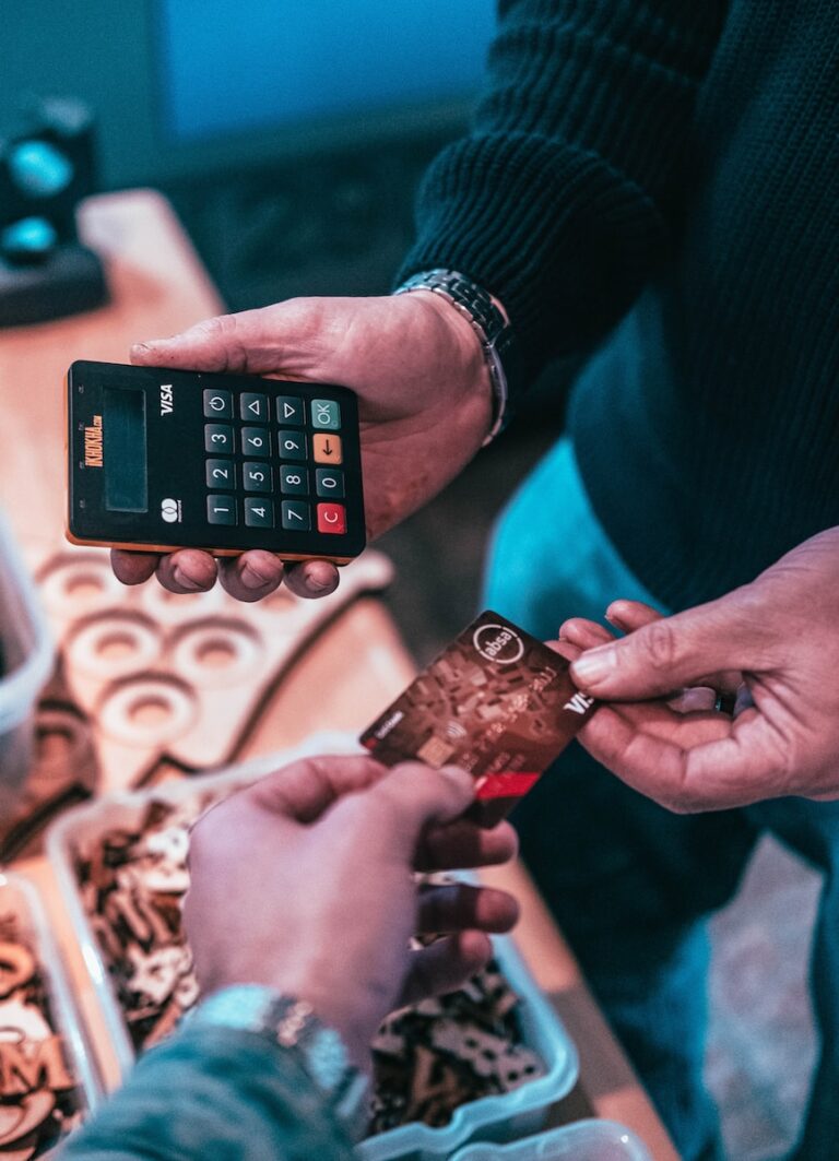 person holding black and silver calculator